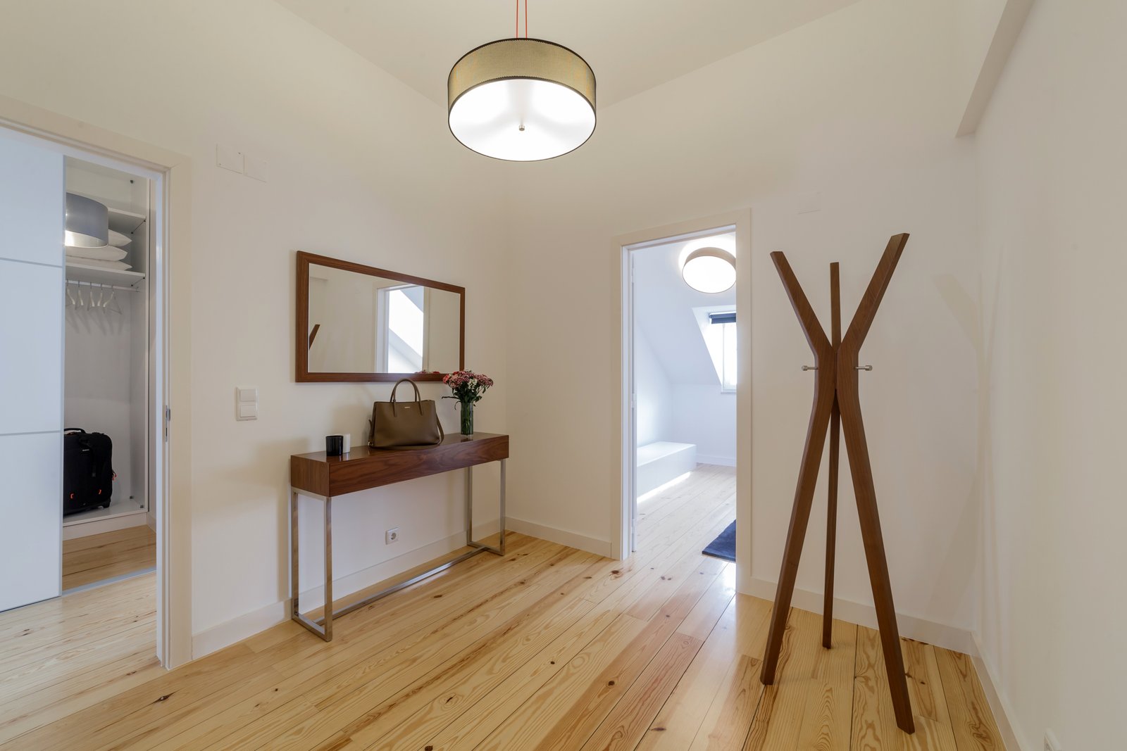 Modern apartment with white walls and light wooden floor Central apartment with elevator